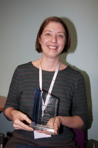 Dr Kate Riney receiving her award at the annual seminar day in Sydney in August 2013