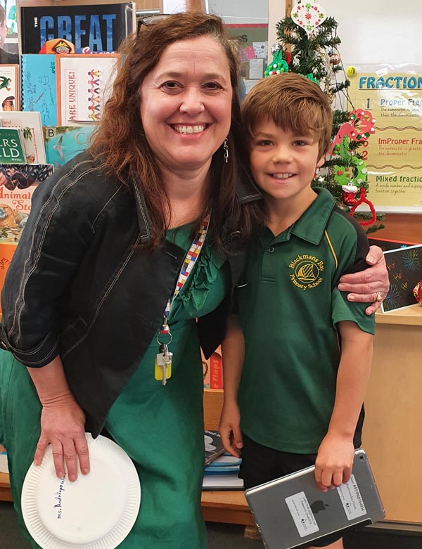 Caleb with one of his teachers 